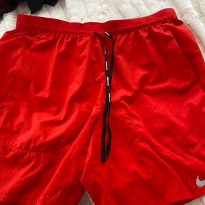 Nike red running shorts